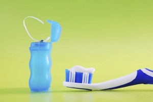 toothbrush with paste and dental floss